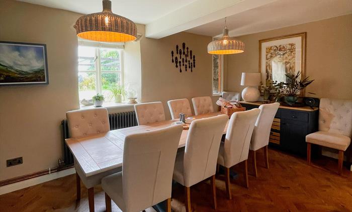 The breakfast table that seats ten in the kitchen at Ysgubor Degwm.